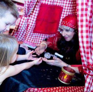Amelie Appleby reads children's palms at Hamleys
