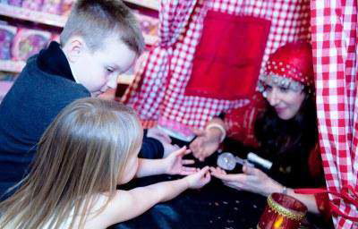 Amelie Appleby reads children's palms at Hamleys