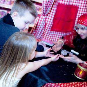 Amelie Appleby reads children's palms at Hamleys